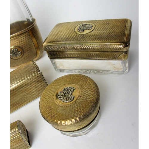 225 - An Edwardian ladies silver gilt toilet set