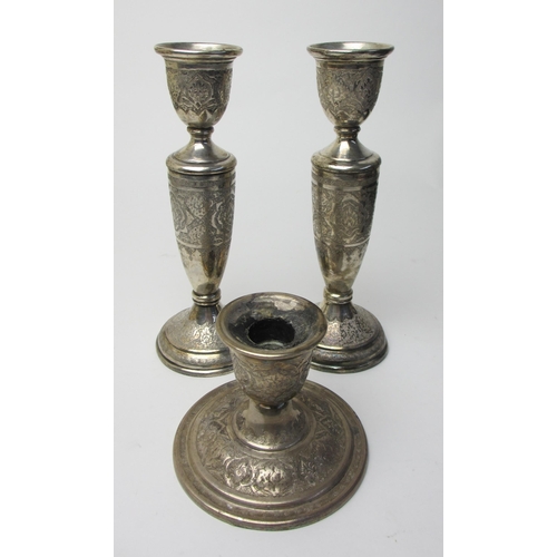 248 - An Eastern white metal candlestick