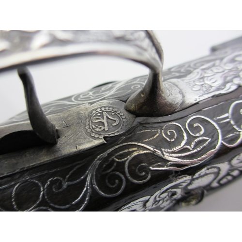 345 - A pair of silver overlaid flintlock pistols