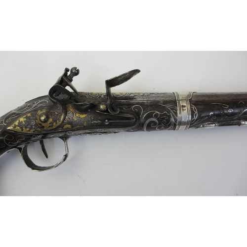 345 - A pair of silver overlaid flintlock pistols