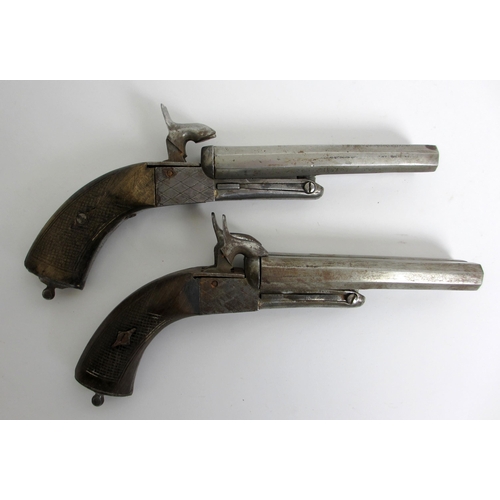 350 - A pair of steel double barrelled pistols