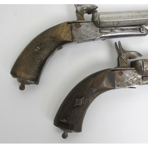 350 - A pair of steel double barrelled pistols