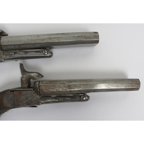 350 - A pair of steel double barrelled pistols