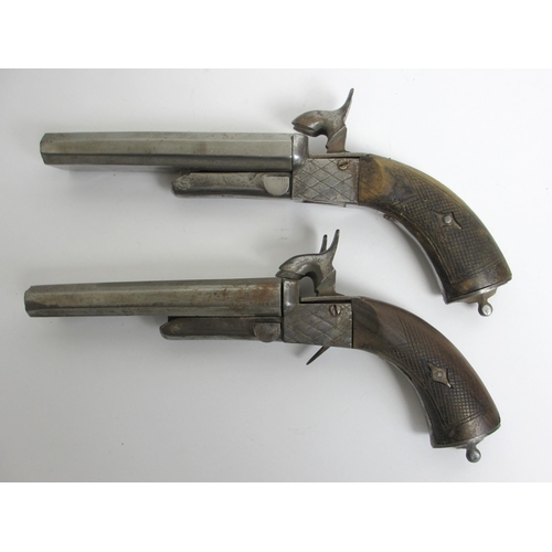 350 - A pair of steel double barrelled pistols