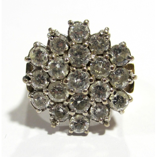 64 - An 18 ct gold and platinum nineteen stone diamond cluster ring