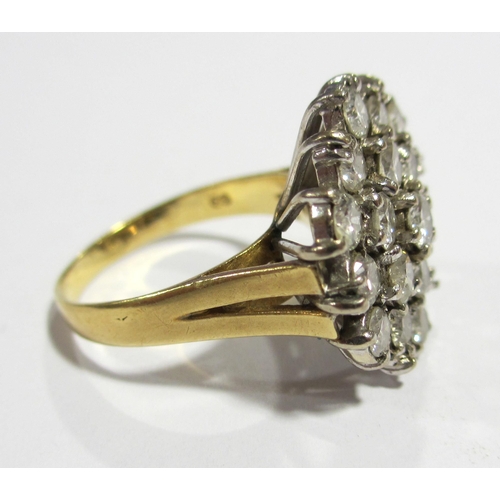 64 - An 18 ct gold and platinum nineteen stone diamond cluster ring