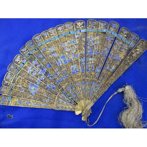 669 - A Chinese gilt metal and enamel fan