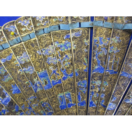 669 - A Chinese gilt metal and enamel fan