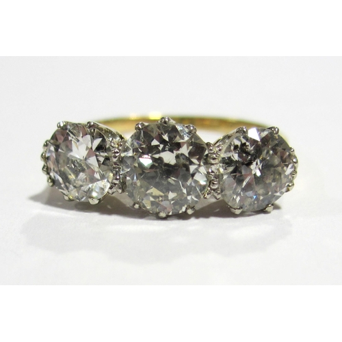 67 - An eighteen carat gold diamond three stone ring