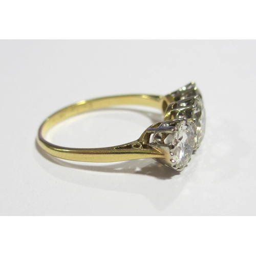 67 - An eighteen carat gold diamond three stone ring