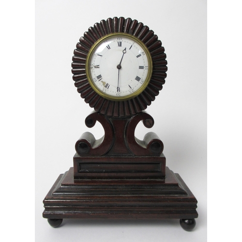 674 - An early 19th century mahogany mantel clock