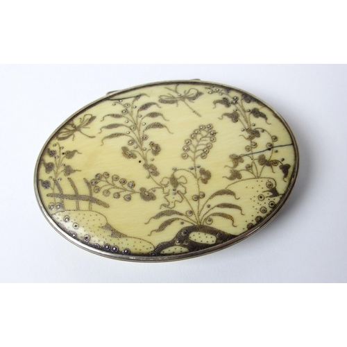 693A - An ivory pique ware oval snuff box