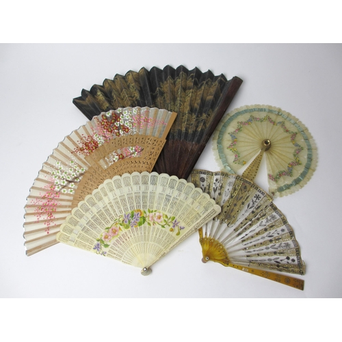 701 - A Chinese black and gilt painted fan