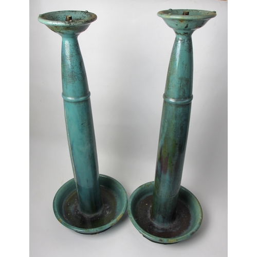 716A - A pair of Arts and Crafts green glazed altar sticks