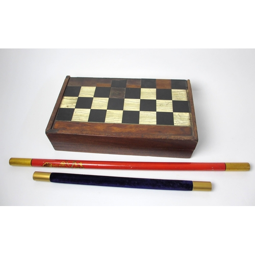 718 - A 19th century ebony and ivory games board and box