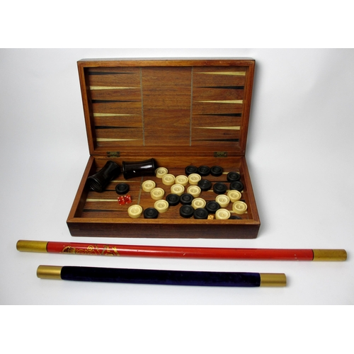 718 - A 19th century ebony and ivory games board and box