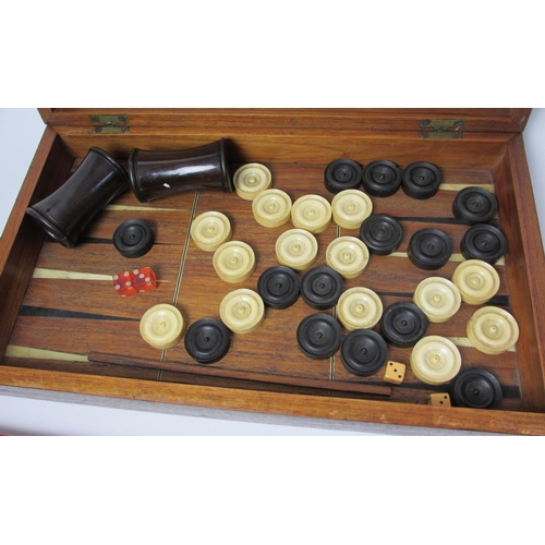 718 - A 19th century ebony and ivory games board and box