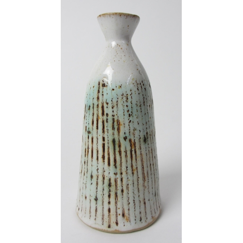 724 - A Lucie Rie stoneware tapering cylindrical vase