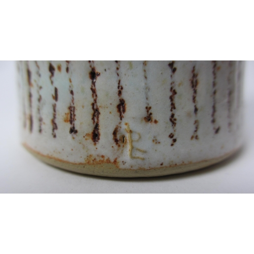 724 - A Lucie Rie stoneware tapering cylindrical vase