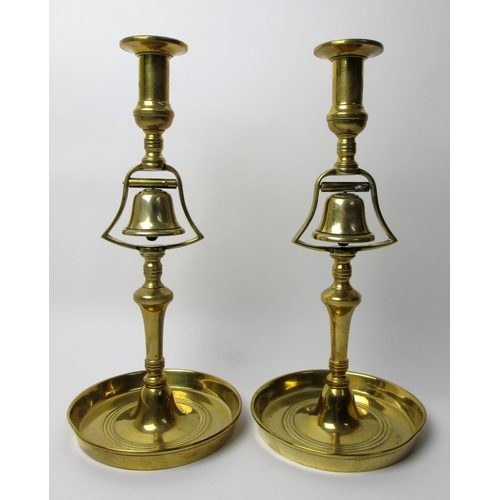 742 - A pair of brass club candlesticks