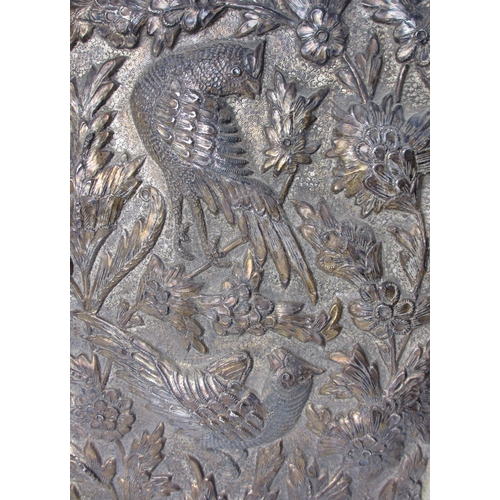 744 - A pair of embossed and hammered metal panels