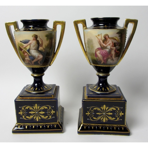 749 - A pair of Austrian two handled urns