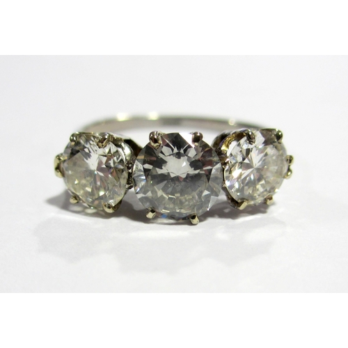 76 - A platinum diamond three stone ring