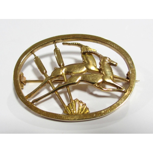 78 - An Ivan Tarratt 9 ct gold oval brooch with antelope and bulrushes