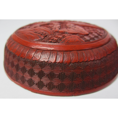 793 - A Chinese cinnabar red lacquer circular box and cover