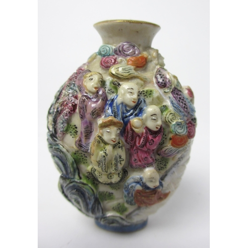 794 - A Chinese porcelain moulded snuff bottle