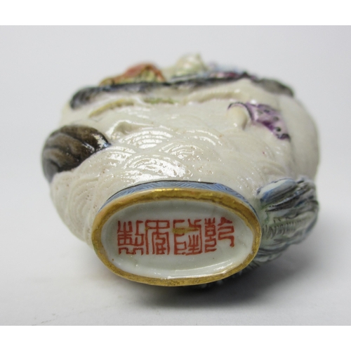 794 - A Chinese porcelain moulded snuff bottle