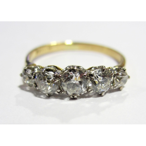 81 - An eighteen carat gold and platinum diamond five stone ring