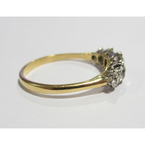 81 - An eighteen carat gold and platinum diamond five stone ring