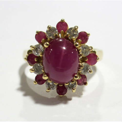 83 - A 14 ct gold star ruby and diamond cluster ring