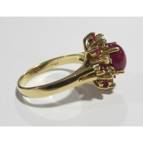 83 - A 14 ct gold star ruby and diamond cluster ring