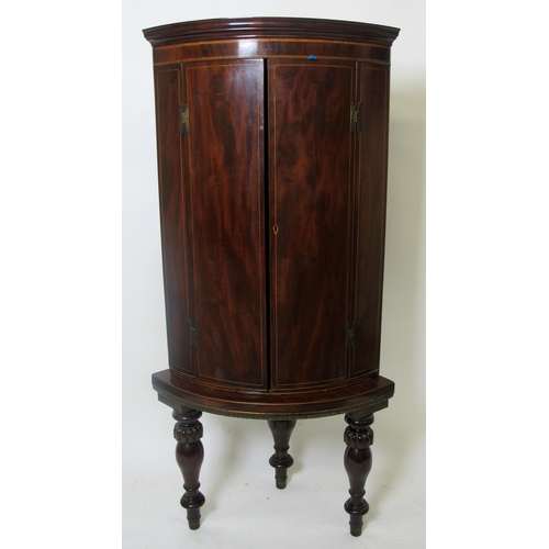 837 - A mahogany inlaid corner cupboard on stand