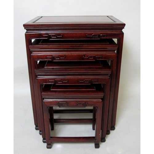 849 - A Chinese style hardwood nest of four tables