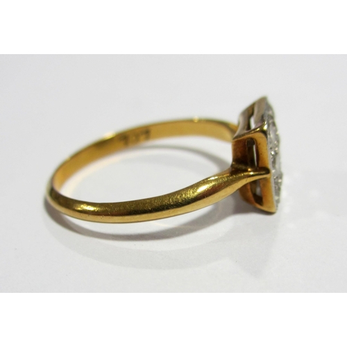 85 - A 1930's 18 ct gold and platinum diamond nine stone ring