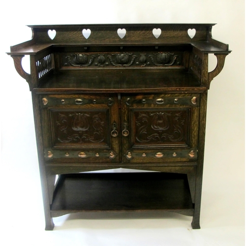 857 - An Arts and Crafts Liberty style oak sideboard  by Wylie & Lochhead