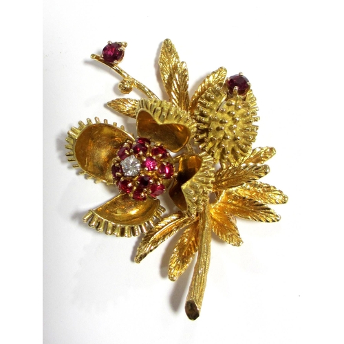 93 - A Continental 18 ct gold ruby and diamond set floriate brooch