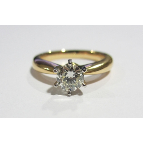 97 - An eighteen carat gold and platinum diamond solitaire ring