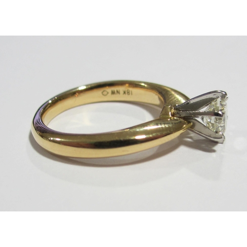 97 - An eighteen carat gold and platinum diamond solitaire ring