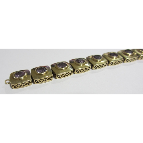 10 - A 9 ct gold amethyst set bracelet