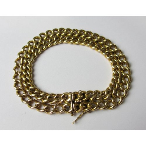 103 - An eighteen carat gold curb link bracelet