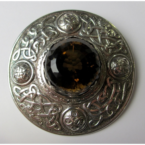 105 - A large silver pated knotwork circular plaid pin  in the style of Alexander Ritchie