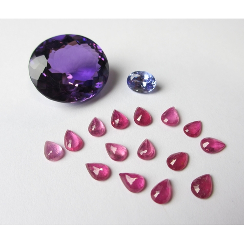 114 - Loose gem stones to include rubies  tanzanite and amethyst