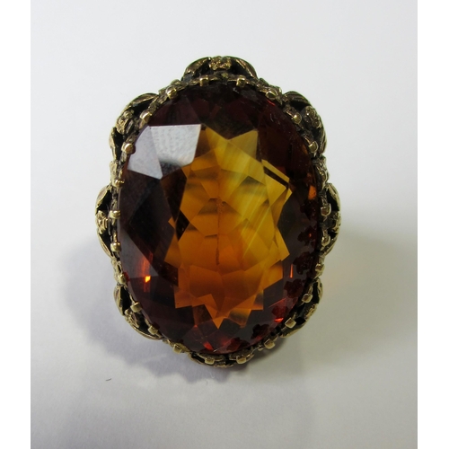 63 - A gold citrine set dress ring