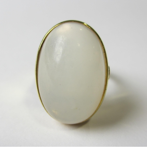 66 - An eighteen carat gold milky quartz set dress ring