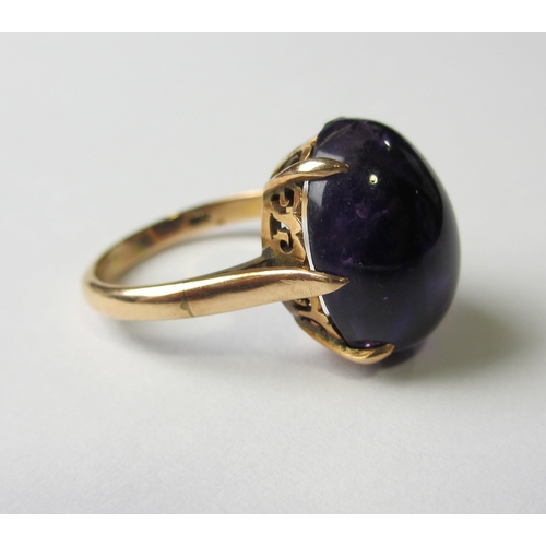 68 - A fourteen carat rose gold cabochon amethyst set dress ring