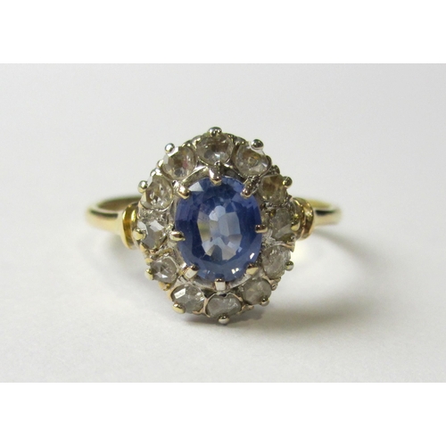 71 - An 18 ct gold Ceylon sapphire and diamond cluster ring